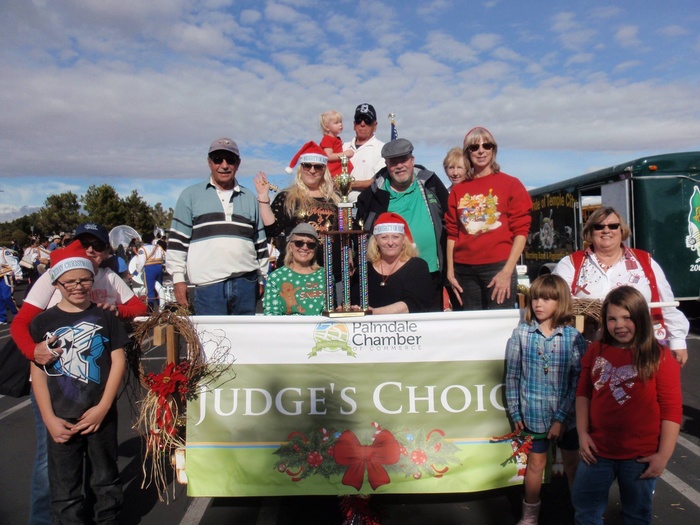 Group of people standing with sign that says "Judge's Choice"