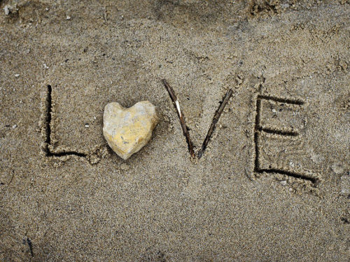 "Love" spelled in the sand