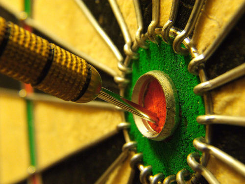 Dart in the bullseye of a dartboard